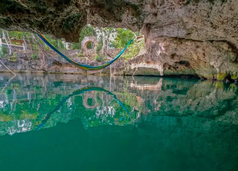 Hammock over a crystal clear cenote in Puerto Morelos