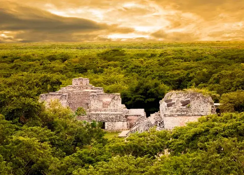 Aerial view of 2 pyramids over the Mayan jungle in Ek Balam